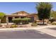 Single-story home with landscaped front yard and two-car garage at 14960 W Cottonwood St, Surprise, AZ 85374