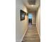 Bright hallway with wood-look tile floors at 14960 W Cottonwood St, Surprise, AZ 85374