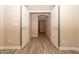 Bright hallway with wood-look floors and neutral wall colors at 14960 W Cottonwood St, Surprise, AZ 85374