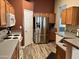 Kitchen with stainless steel refrigerator and wood cabinets at 14960 W Cottonwood St, Surprise, AZ 85374