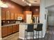 Kitchen boasts a breakfast bar with seating and modern finishes at 14960 W Cottonwood St, Surprise, AZ 85374