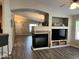 Living room features a fireplace and built-in entertainment center at 14960 W Cottonwood St, Surprise, AZ 85374