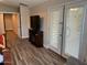 Main bedroom with French doors and wood floors at 14960 W Cottonwood St, Surprise, AZ 85374