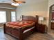 Main bedroom with king-size bed and wood floors at 14960 W Cottonwood St, Surprise, AZ 85374