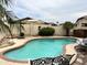 Relaxing kidney shaped pool in a sunny backyard at 14960 W Cottonwood St, Surprise, AZ 85374