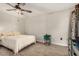 Cozy bedroom with ceiling fan and light wood floors at 16033 N 110Th Ave, Sun City, AZ 85351