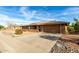 Single story home with rock landscaping and two car garage at 16033 N 110Th Ave, Sun City, AZ 85351