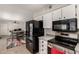 Kitchen boasts black appliances and gray countertops at 16033 N 110Th Ave, Sun City, AZ 85351