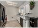 Modern kitchen featuring black appliances and gray countertops at 16033 N 110Th Ave, Sun City, AZ 85351