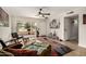 Open living room with wood-look floors and colorful rug at 16033 N 110Th Ave, Sun City, AZ 85351