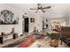 Open living room with wood-look floors and colorful rug at 16033 N 110Th Ave, Sun City, AZ 85351