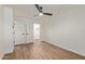 Bedroom has wood-look floors, white walls, ceiling fan and double door closet at 1702 W Tuckey Ln # 123, Phoenix, AZ 85015