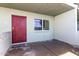 Welcoming entryway featuring a red security door and a large window at 1702 W Tuckey Ln # 123, Phoenix, AZ 85015