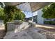 Outdoor grilling area with built-in stone counter, stainless steel grills, and covered patio for entertaining at 1702 W Tuckey Ln # 123, Phoenix, AZ 85015