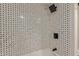 Modern Shower tiled in classic black and white tile with matte black shower head and faucet at 1702 W Tuckey Ln # 123, Phoenix, AZ 85015