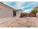 Spacious backyard with gravel, artificial turf, and a charming pergola at 17347 W Statler St, Surprise, AZ 85388