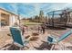 Outdoor fire pit area with comfortable seating and recreational trampoline at 17347 W Statler St, Surprise, AZ 85388