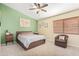 Comfortable bedroom with a ceiling fan, neutral carpeting, and a window with blinds at 17347 W Statler St, Surprise, AZ 85388