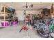 Two-car garage, offering ample storage with shelving and concrete flooring at 17347 W Statler St, Surprise, AZ 85388