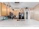 Bright kitchen featuring light wood cabinets, a subway tile backsplash, and sleek quartz countertops at 17347 W Statler St, Surprise, AZ 85388