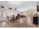 Bright and airy living room with tile flooring, a dining area, and a glimpse into the kitchen for seamless living at 17347 W Statler St, Surprise, AZ 85388