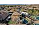 Aerial view of house, pool, and surrounding neighborhood at 18651 E Superstition Dr, Queen Creek, AZ 85142