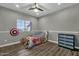 bedroom with wood floors and a dresser at 18651 E Superstition Dr, Queen Creek, AZ 85142