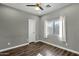 Well-lit bedroom with wood flooring and a window at 18651 E Superstition Dr, Queen Creek, AZ 85142