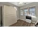 Bright bedroom with wood flooring and large window at 18651 E Superstition Dr, Queen Creek, AZ 85142