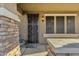 Ornate front door with sidelights and decorative stonework at 18651 E Superstition Dr, Queen Creek, AZ 85142