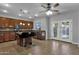 Spacious kitchen with island, stainless steel appliances, and dark wood cabinetry at 18651 E Superstition Dr, Queen Creek, AZ 85142