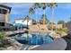 Inviting kidney shaped pool with palm trees and patio at 18651 E Superstition Dr, Queen Creek, AZ 85142