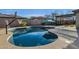 Refreshing kidney shaped pool with patio and basketball court at 18651 E Superstition Dr, Queen Creek, AZ 85142