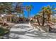 Long driveway leading to a beautiful home with palm trees at 19127 E Wiki Way, Rio Verde, AZ 85263