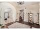 Bright and airy entryway with hardwood floors and archway at 19127 E Wiki Way, Rio Verde, AZ 85263