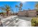 Two-car garage with a spacious driveway and desert landscaping at 19127 E Wiki Way, Rio Verde, AZ 85263