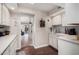 White kitchen features granite countertops, stainless steel appliances, and ample cabinetry at 19127 E Wiki Way, Rio Verde, AZ 85263