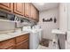 Bright laundry room with washer, dryer, and ample storage at 19127 E Wiki Way, Rio Verde, AZ 85263