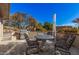 Relaxing patio area with seating, grill, and desert landscape at 19127 E Wiki Way, Rio Verde, AZ 85263