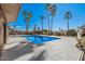 Inviting swimming pool surrounded by palm trees at 19127 E Wiki Way, Rio Verde, AZ 85263