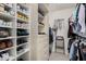 Spacious walk-in closet with ample shelving and hanging space at 19127 E Wiki Way, Rio Verde, AZ 85263