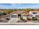 Single-story home with desert landscaping, two-car garage, and mountain views at 20642 N 268Th Dr, Buckeye, AZ 85396