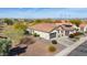 Single-story home with tile roof, driveway, and desert landscaping at 20642 N 268Th Dr, Buckeye, AZ 85396