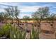 Landscaped backyard with desert plants and golf course view at 20642 N 268Th Dr, Buckeye, AZ 85396