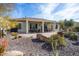 Backyard patio with seating area and desert landscaping at 20642 N 268Th Dr, Buckeye, AZ 85396