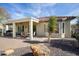 Backyard patio with seating area and desert landscaping at 20642 N 268Th Dr, Buckeye, AZ 85396