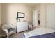 Guest bedroom with white dresser and wicker chairs, offering a relaxing space at 20642 N 268Th Dr, Buckeye, AZ 85396