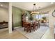 Bright dining room with large windows and chandelier at 20642 N 268Th Dr, Buckeye, AZ 85396