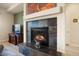 Living room fireplace with slate tile surround at 20642 N 268Th Dr, Buckeye, AZ 85396