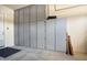 Garage with built-in storage cabinets at 20642 N 268Th Dr, Buckeye, AZ 85396